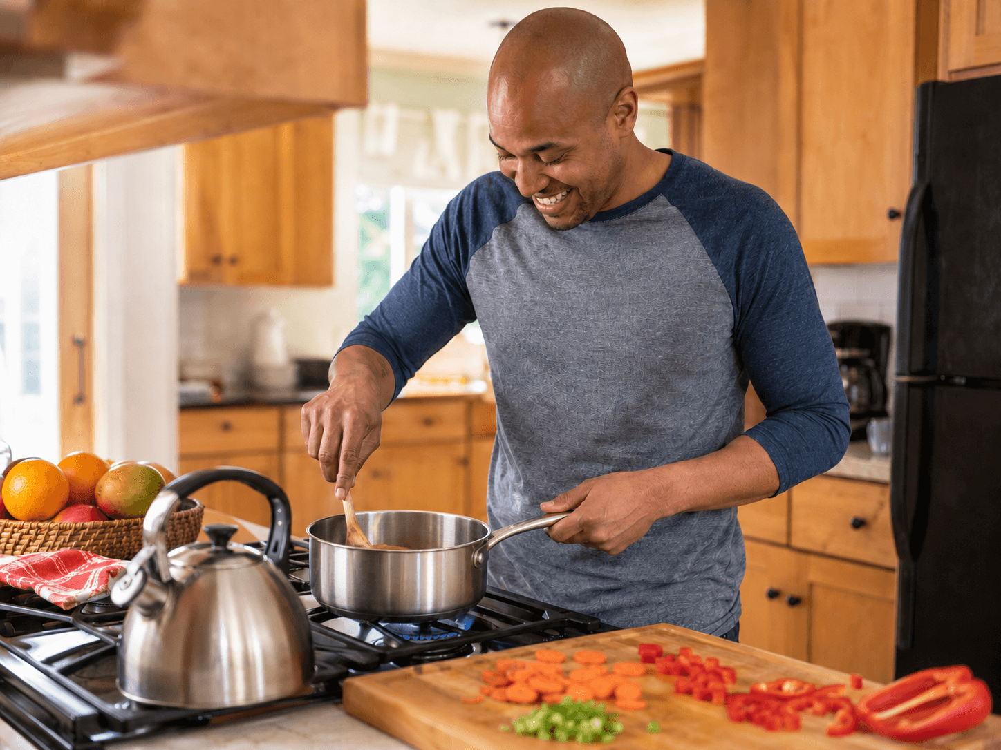 A cook plating food in a home kitchen