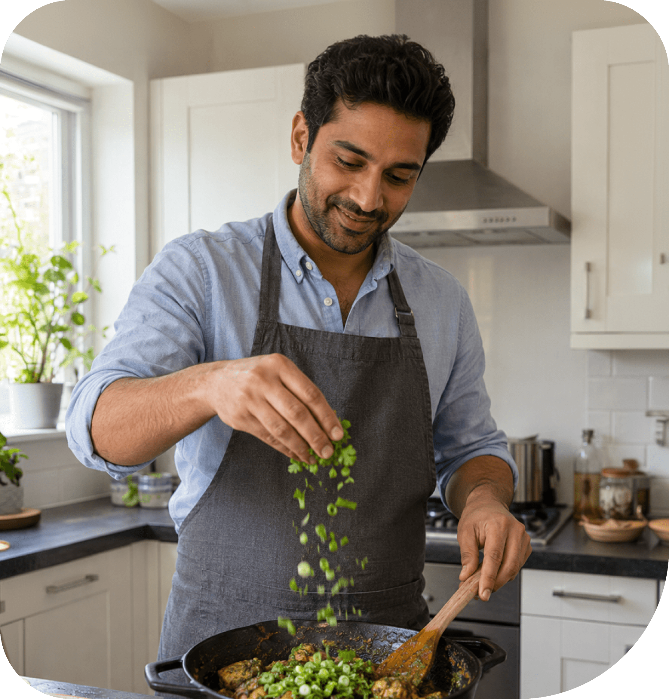 A cook preparing food at a stovetop
