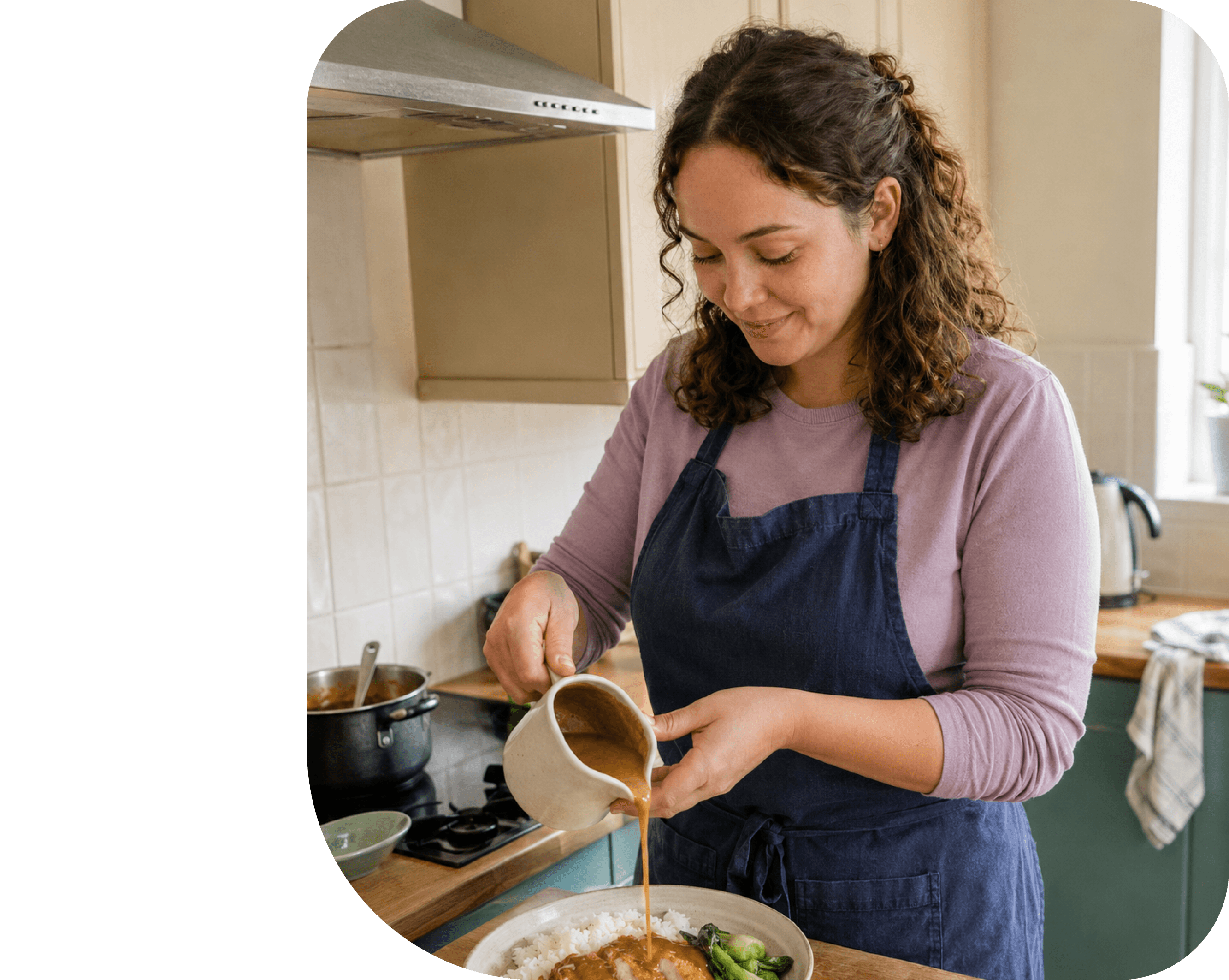 Two cooks preparing food together and smiling